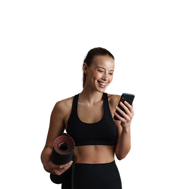 A woman with a yoga mat and a phone