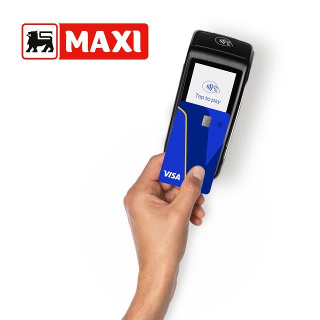A hand holds a blue Visa card near a card reader displaying "Tap to pay." The MAXI logo appears in the top left corner.